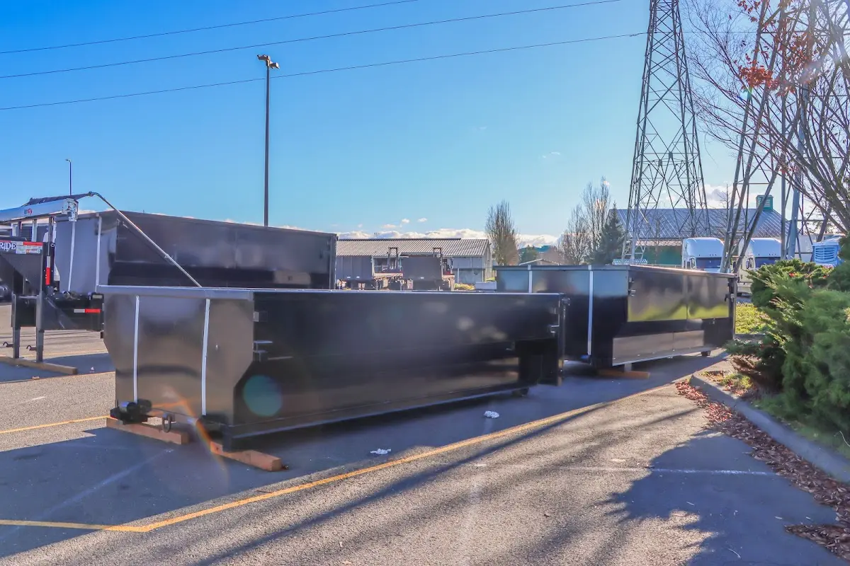 Roll-off dumpster ready for waste disposal at job site for 2 Yard Dumpster Rental in Keokuk